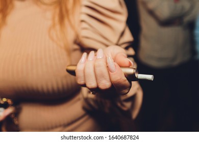Modern hybrid cigarette device without burning tobacco, alternative smoking. - Shutterstock ID 1640687824