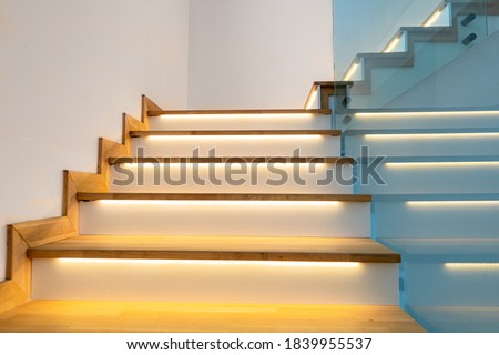 Modern illuminated wooden staircase indoor.