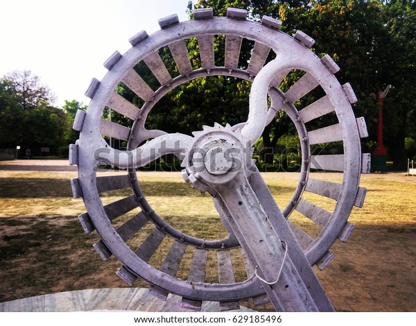 modern indian well wheel made of iron to\
take out fresh water directly from the\
earth.
