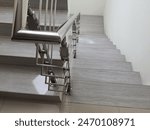 Modern indoor stairs with elegant stainless steel handrails