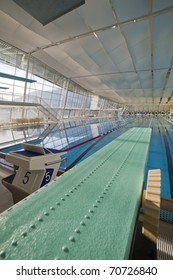 Modern Indoor Swimming Pool With Green Spring Board