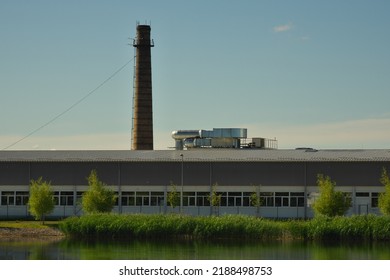 Modern Industrial Building. Old Brick Chimney.