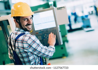 Modern Industrial Machine Operator Working In Factory