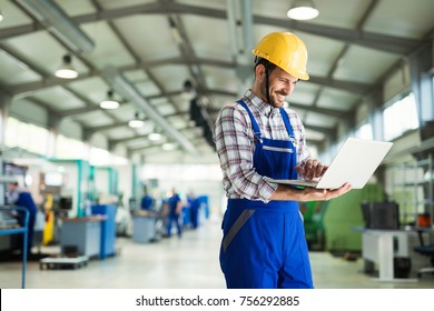 Modern Industrial Machine Operator Working In Factory