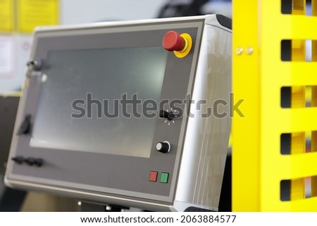 Modern industrial remote touchscreen control panel. Selective focus.
