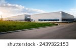 Modern Industrial Warehouse at Sunset with Clear Sky