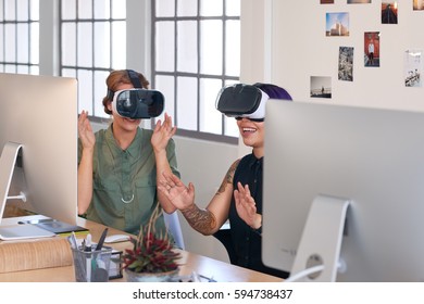 Modern innovative professionals using technology like virtual reality headsets in their work, visualising designed spaces