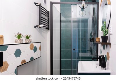 Modern Interior Of Bathroom With Cabin Of Shower And Green Tiles On The Wall. Stylish Pattern Tile And Bathroom Sink In Washroom At Home.