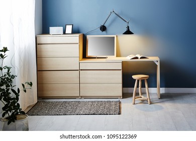 Modern Interior Of Bed Room With Wooden Dresser