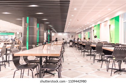Modern interior of cafeteria or canteen with chairs and tables, eating room in selective focus - Shutterstock ID 1109442980