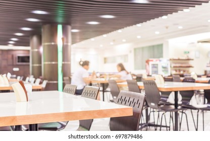 Modern interior of cafeteria or canteen with chairs and tables