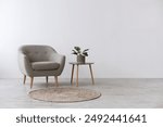 Modern interior design with light empty mock-up wall and gray furniture, loft and vintage of living room. Armchair, table with green plant in pot, round carpet on floor, on white wall background