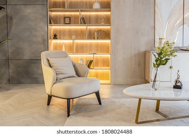 Modern Interior Design Of The Living Area In The Studio Apartment In Warm Soft Colors. Decorative Built-in Lighting And Soft Beige Furniture