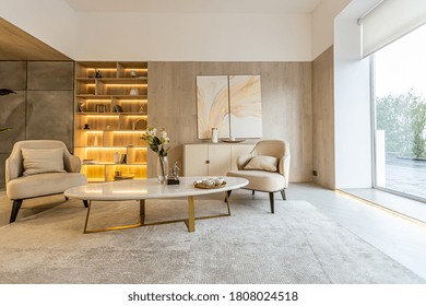 modern interior design of the living area in the studio apartment in warm soft colors. decorative built-in lighting and soft beige furniture - Powered by Shutterstock