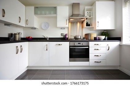 Modern Interior Of A Large Kitchen With Modular Furniture In White Color