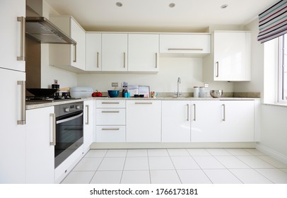 Modern Interior Of A Large Kitchen With Modular Furniture In White Color