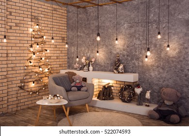 Modern interior of living room. Creative Christmas tree, contemporary fireplace and large gray armchair in loft interior design apartment. - Powered by Shutterstock