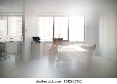 Modern Interior Of Office For Small Conference Meetings With Table And Desktop Computer