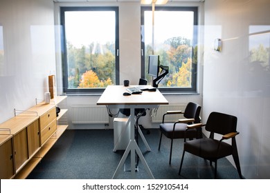 Modern Interior Of Office. A Stand Up Desk  With Desktop Computer In Modern Workplace