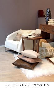 Modern Interior Quiet Corner With Armchair And Open Book On Coffee Table