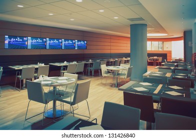 Modern Interior Of Restaurant With Tv Wall