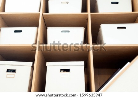 Modern interior white boxes in wooden shelfs for storage, modern interior clean up organized