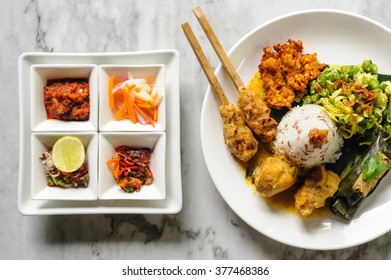 Modern Interpretation Of Indonesian Nasi Campur With Sate, Ubud, Bali, Indonesia.