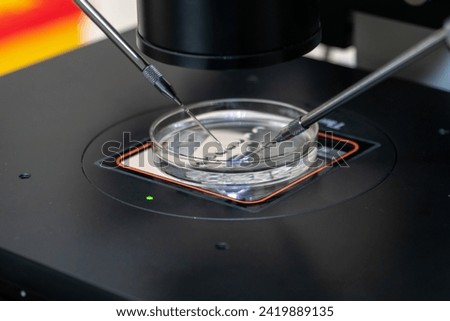 Modern IVF micromanipulator with Petri Dish in the laboratory of the in vitro fertilization. for insemination of the egg freezing. Sperm cryopreservation. Ovum fertilization procedure