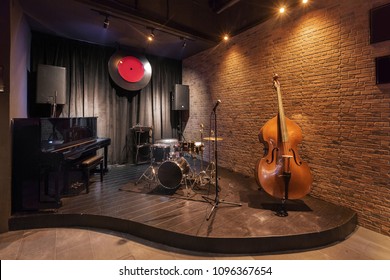 Modern Jazz Bar Interior Design, Stage With Black Piano And Cello