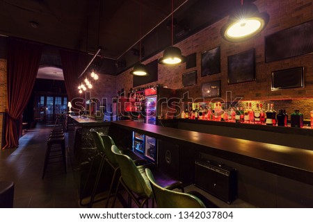Modern jazz bar interior design, lamps above bar counter