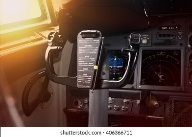 Modern jet airliner plane with glass cockpit at sunset