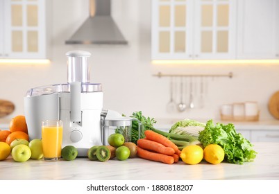 Modern juicer, fresh vegetables and fruits on table in kitchen - Powered by Shutterstock