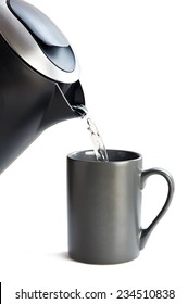 Modern Kettle Pouring Water Into A Cup On A White Background