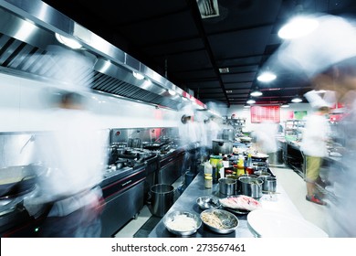 Modern Kitchen And Busy Chefs In Hotel