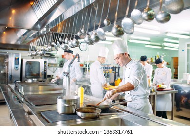 Modern kitchen. The chefs prepare meals in the restaurant's kitchen. - Powered by Shutterstock