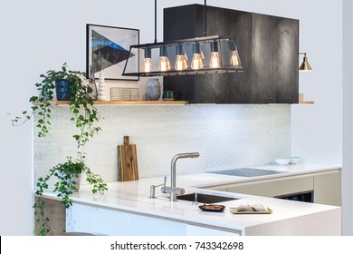 Modern Kitchen Design In Home Interior. Facades Are Painted And Made Of Natural Stone. Project Management. Loft Light Fixture Lights In Black Metal Frame Shade With Clear Panel Glass. Copper Wire.