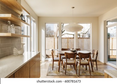 Modern Kitchen with dinning are and stylish furniture.