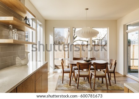 Modern Kitchen with dinning are and stylish furniture.