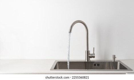 Modern kitchen faucet and sink - Powered by Shutterstock