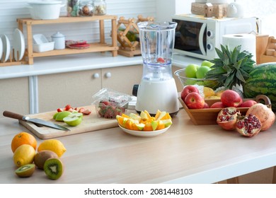 Modern kitchen with fruits and vegetables on wooden table - Powered by Shutterstock