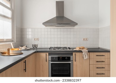 Modern kitchen with gas stove, cabinets, and appliances - Powered by Shutterstock