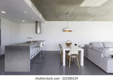 modern kitchen with gray tile floor and white wall