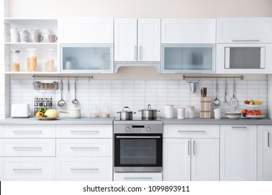 Modern kitchen interior with houseware and new furniture