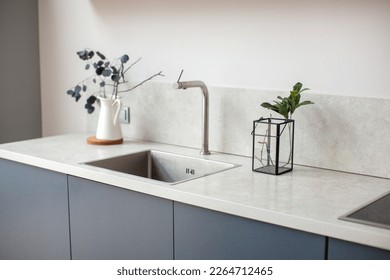 Modern kitchen interior in scandinavian style and gray tones. Kitchen worktop. - Powered by Shutterstock