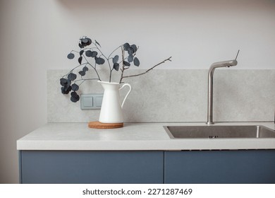 Modern kitchen interior in scandinavian style and gray tones. Kitchen worktop. - Powered by Shutterstock