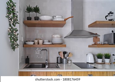 Modern Kitchen Interior With White Brick Tile Wall In Scandinavian Style, Wooden Shelf And Tableware