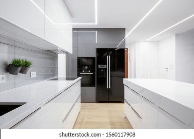 Modern Kitchen Interior In White And Gray With Stylish Led Ceiling Lights