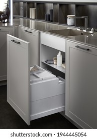 Modern Kitchen, Open Pull Out Drawers, Sink Waste Bin In Kitchen Drawer. Stainless Steel Drawer Box Side.