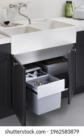 Modern Kitchen, Open Pull Out Drawers, Sink Waste Bin In Kitchen Drawer. Stainless Steel Drawer Box Side.