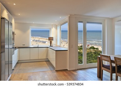 Modern Kitchen In Renovated House With View On Beach At Summer